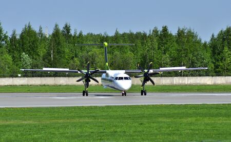 The plane is on the runway. Bombardier Dash 8Q-400 .Pulkovo Airport.