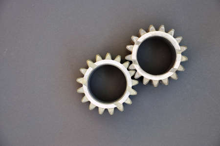 metal cogs cogwheels on a dark background.の写真素材