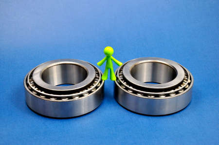 Roller bearings on a blue background. Spare parts for cars.の写真素材