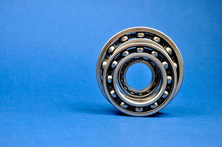 Ball bearings on a blue background. Spare parts.の写真素材