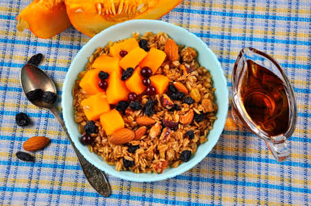 Fresh Granola, muesli with pumpkin, nuts, cranberries and honey. Top view