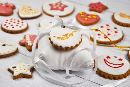 Colorful Icing cookies. Christmas homemade cookies on wooden table.