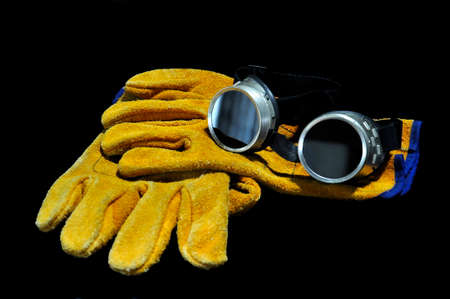 Protective goggles and gloves for gas welding. protective equipment.の写真素材