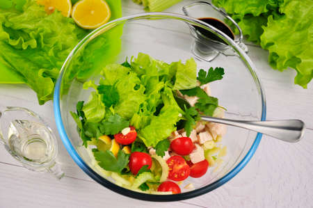 Vegetable salad with fresh tomato and chicken.の写真素材