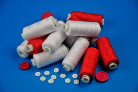 Colorful buttons and multicolored threads for sewing clothes.