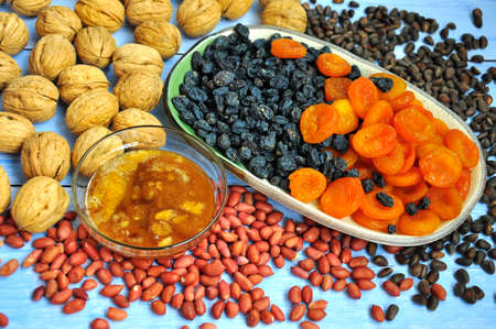 Mix of nuts and dried fruits. food background.の写真素材