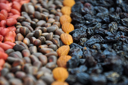 Mix dried fruits and different nuts on the table. food background.の写真素材
