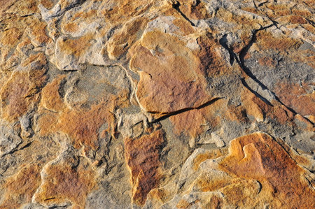 Reddish rock surface, wall texture for background