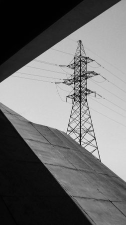 electricity pylon in the city, black and white photo.
