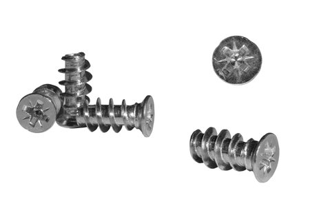 Close-up of Euro screws with countersunk heads showing their intricate design and metallic finish, ideal for various construction projectsの写真素材