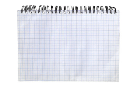 A blank graph paper notebook lying on a table, ready for drawing or calculations in a bright workspace during the daylight hoursの写真素材