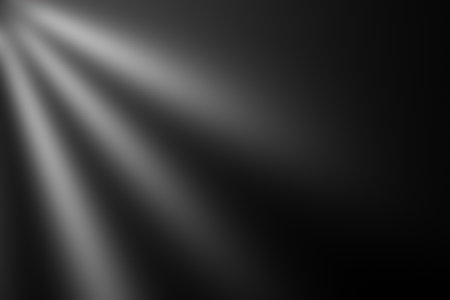 A soft gradient background with subtle light rays emanating from the top left corner, creating a serene and atmospheric effect.の写真素材