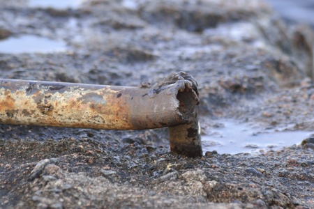 Stack of rusty old pipeの写真素材