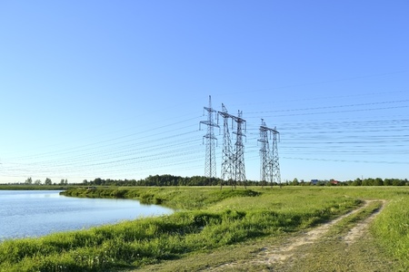 High voltage line near the lake . の写真素材