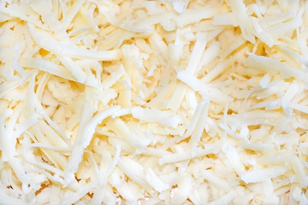 High resolution yellow grated cheese background .の写真素材