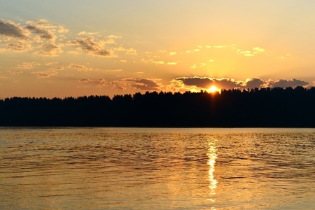 Lake landscape in with sunset. Dark soft colors.の写真素材