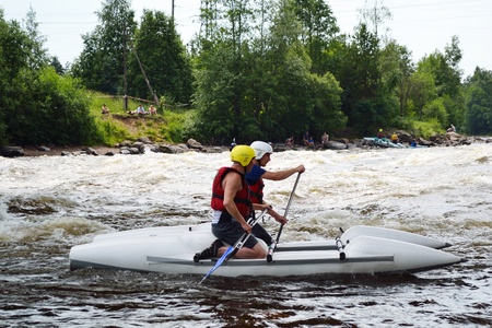 River Vuoksi, Leningrad Region, Russia - 3 July 2011: Kayaker sporting a kayak cuts through water.