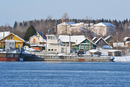 View of Voznesenje town and Svir river in sunny winter day, Russiaのeditorial素材