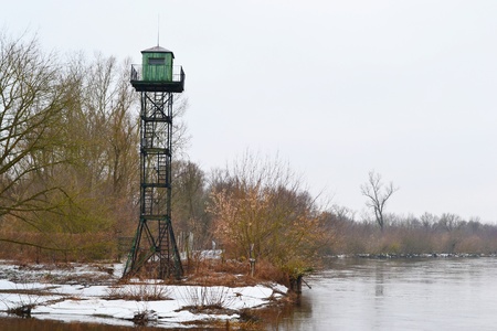 Border tower on the river coast Mukhavets, Brest, Belarus. Early spring.のeditorial素材