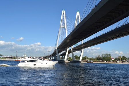 St.Petersburg, Russia - June 3, 2011: Cable-stayed bridge and a yacht sailing on the Nevaのeditorial素材