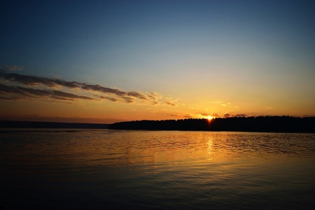 Beautiful romantic sunset over a calm lake