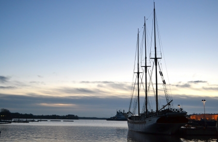 Yacht mast silouette in dawn at Helsinki's quay, Finland