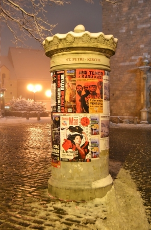 Riga, Latvia - December 9, 2012: Street poles covered with posters in ctnter of Riga at nightのeditorial素材