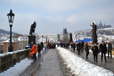 Prague, Czech Republic - 24 February 2013: Tourists walk on the Ancient Charles Bridge in the center of Pragueのeditorial素材