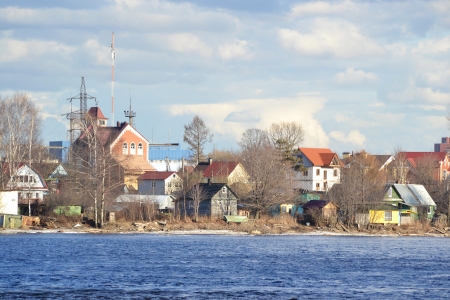 Bank of the river Neva on the outskirts of St. Petersburg at sunny spring evening, Russiaのeditorial素材