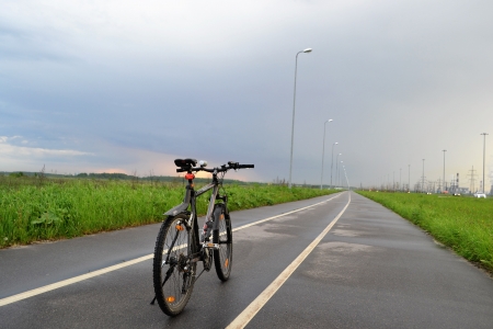 Mountain bike on the bike path at cloudy dayの写真素材
