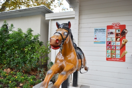 Montreux, Switzerland - November 6, 2013: Amusement ride a horse on the promenade of Montreuxのeditorial素材