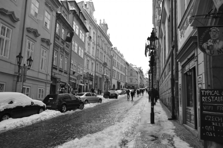 Prague, Czech Republic - February 24, 2013: Street in center of Prague at winter. Black and white.のeditorial素材