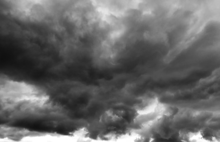 Dark, ominous storm clouds. Black and white.