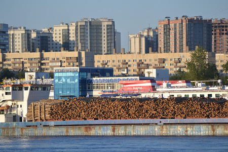 ST.PETERSBURG, RUSSIA - JULY 22, 2014: Cargo ship and embankment of the Neva river, outskirts of St....