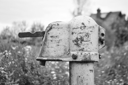 Outdoor water column in Ust Slav village, outskirts of St. Petersburg, Russia. Black and white.