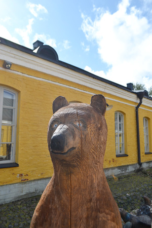 LAPPEENRANTA, FINLAND - AUGUST 21, 2014: Wooden sculpture of a bear in Lappeenranta, Finland.のeditorial素材