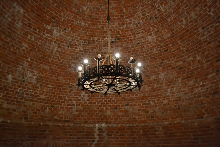Interior of an old castle with a vintage chandelier in Sigulda, Latvia.