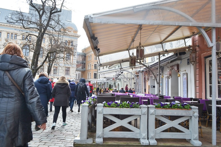 RIGA, LATVIA - APRIL 18, 2015: Cafe on the street in center of Riga.のeditorial素材