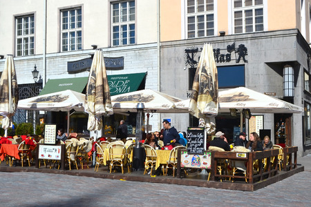 TALLINN, ESTONIA - APRIL 20, 2015: Street cafe on Town Hall Square in center of Tallinn. Tallinn - the largest city and the capital of Estonia. The city was founded in 1154.のeditorial素材