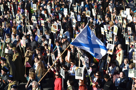 ST.PETERSBURG, RUSSIA: - MAY 9, 2015: The action "Immortal regiment" on Victory parade. People go with portraits of their relatives, who participated in the Second World War. The celebration of 70 anniversary of Victory in the Great Patriotic War.のeditorial素材
