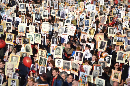 ST.PETERSBURG, RUSSIA: - MAY 9, 2015: The action "Immortal regiment" on Victory parade. People go with portraits of their relatives, who participated in the Second World War. The celebration of 70 anniversary of Victory in the Great Patriotic War.のeditorial素材