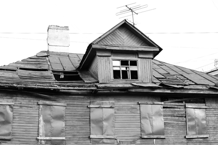 Abandoned wooden building in Kolpino town on the outskirts of St. Petersburg, Russia. Black and white.の写真素材
