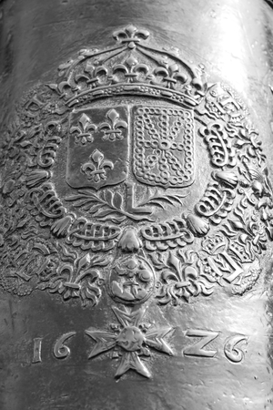 ST.PETERSBURG, RUSSIA - 17 APRIL 2016: Fragment of bronze barrel of the old cannon, can be used as background. Black and white.のeditorial素材