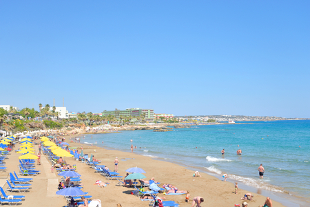 HERSONISSOS, GREECE - 28 MAY 2016: Beach in Limenas Chersonisou. Hersonissos - a city in the north of Crete, located between the Mediterranean and Aegean seas. The city is focused on tourists.のeditorial素材
