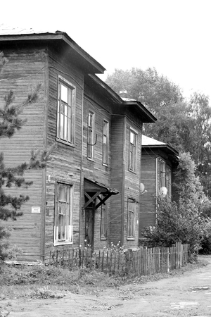 VOLOGDA, RUSSIA - 12 AUGUST 2016: Old wooden building in the central part of Vologda. The city's population - 312,686 people. It is one of the largest cities in north-west Russia. Black and white.のeditorial素材