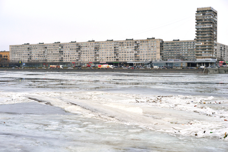 ST.PETERSBURG, RUSSIA - 9 MARCH 2016: Embankment of Neva River at cloud spring day, outskirts of St.Petersburg, Russia.のeditorial素材