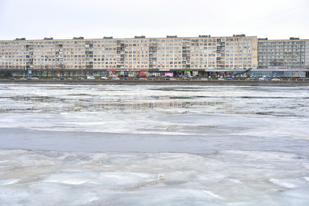 ST.PETERSBURG, RUSSIA - 9 MARCH 2016: Embankment of Neva River at cloud spring day, outskirts of St.Petersburg, Russia.のeditorial素材