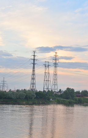 Power line and Neva River at evening on the outskirts of St. Petersburg, Russia.の写真素材