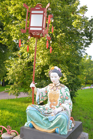 ST.PETERSBURG, RUSSIA - 17 JULY 2016: Chinese figure in traditional dress in Tsarskoe Selo. Fragment of the Great Chinese bridge in the Alexander Park, , suburb of St.Petersburg.のeditorial素材