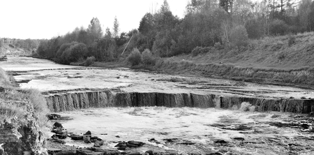 Small waterfall on Tosna River in Leningrad Region, Russia. Black and white.の写真素材